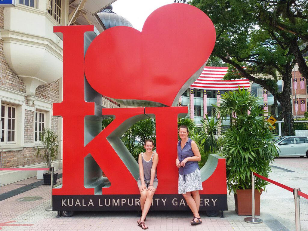 Renata Green and Mimi at the I love KL sign