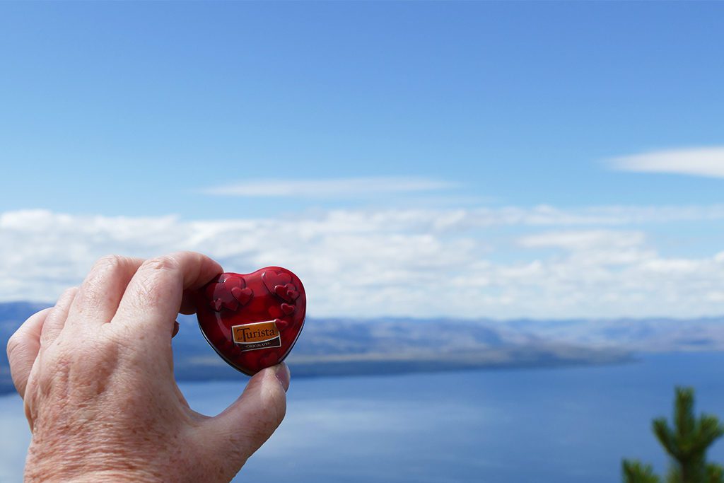 A chocolate heart in the backdrop of Lake Nahuel Huapi during a Swiss Vacation in Argentina