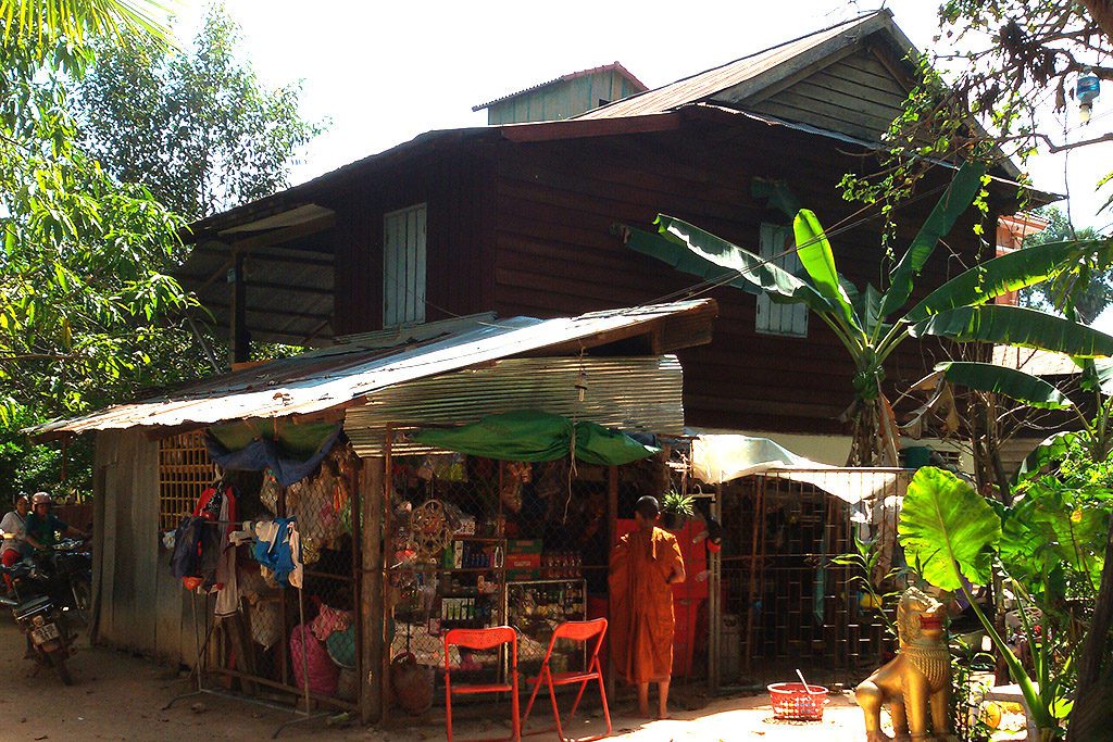 Buddhist monk buying snacks in Siem Reap
