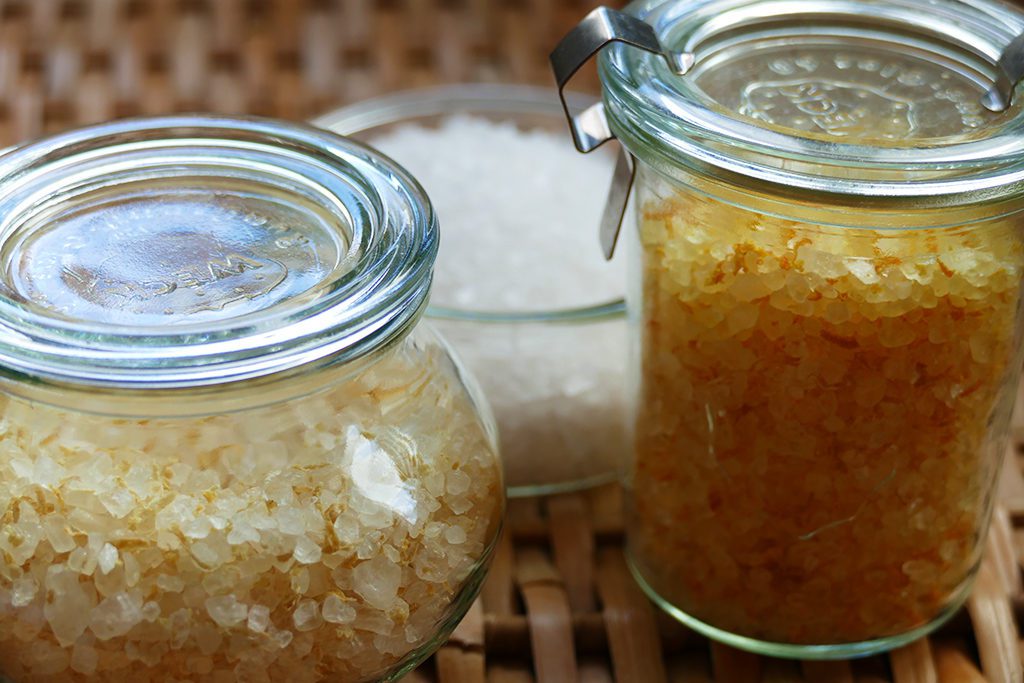 Homemade Mediterranean Lemon and Orange Salt, potted in glass jars.