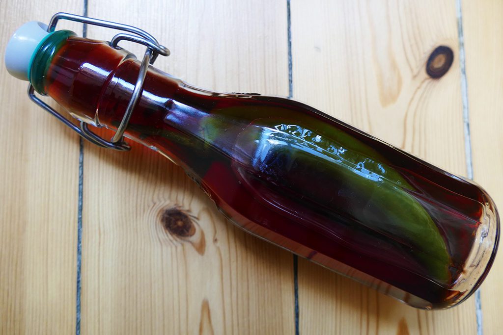 Bottle of pickled pepper wine