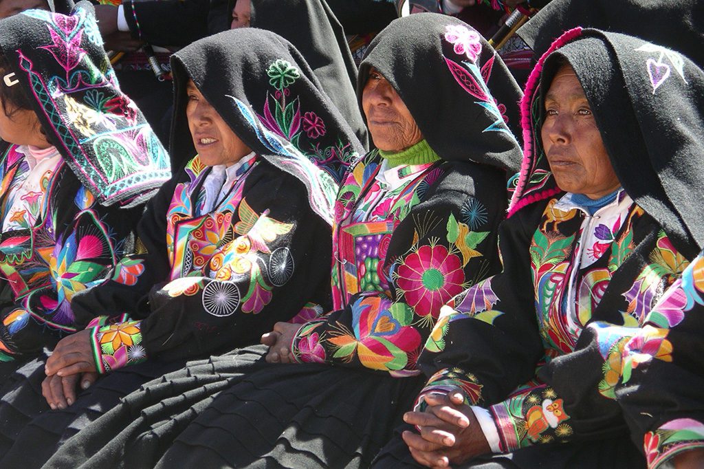 Women on Isla Taquile on Lake Titicaca after visiting the Uros Islands on a trip from PUNO 