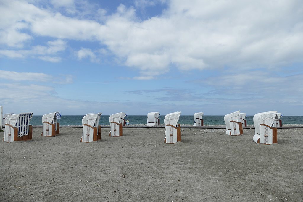 Hooded wicker chairs on Fehmarn’s western shore.