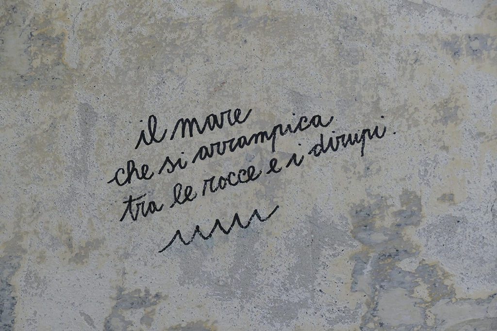 Poetic writing on the wall of The Poet Hotel in La Spezia, the gateway to the Cinque Terre.