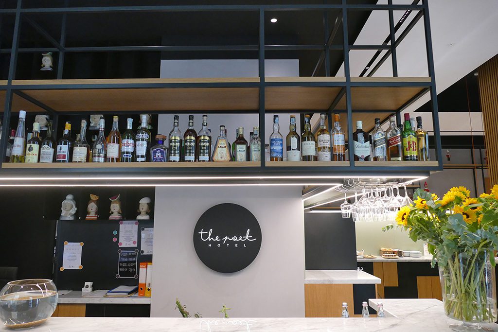 The reception and the bar are one at The Poet Hotel in La Spezia