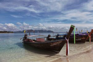 Iconic longtail boats on the shores of the Andaman Sea