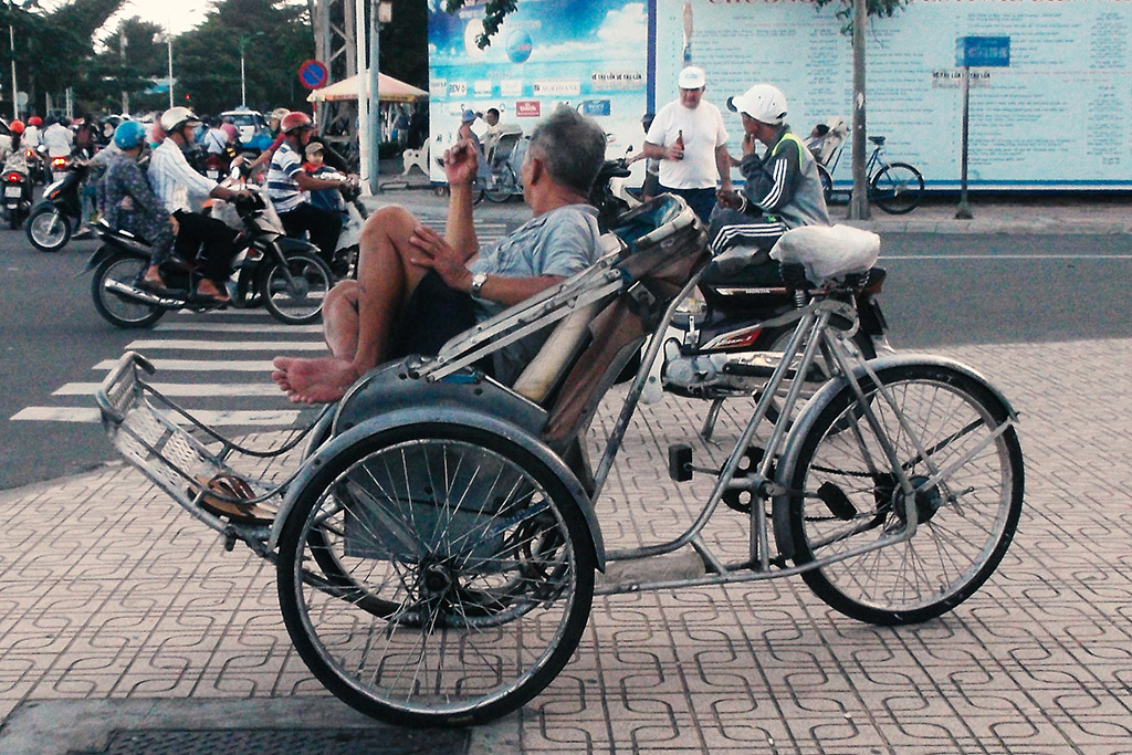 Man in a bicycle rikshaw in Nha Trang.