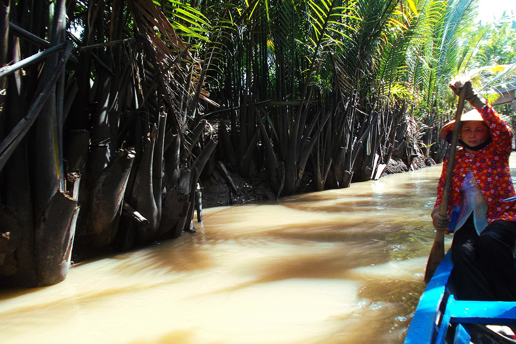 Boat on a creek at the Mekong Delta