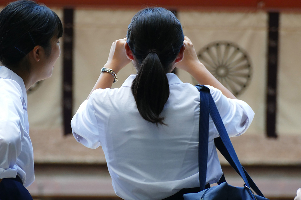 Two girls taking pictures at Nara