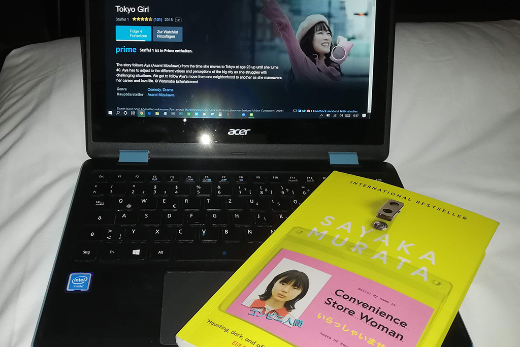 computer with tv series Tokyo Girl and book Convenience Store Woman
