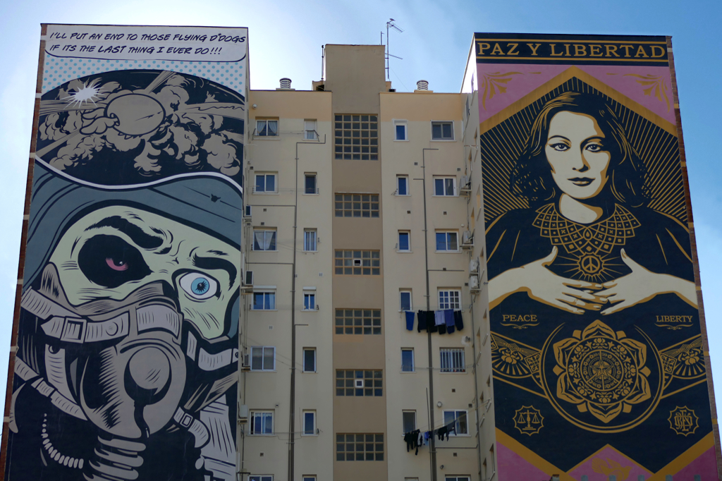 D*Face has decorated the left part of the house at Calle Comandante Benítez 14 in a adventure comic style. On the right part, Frank Shepard Fairey aka OBEY left some beautifuly Paz y Libertad, Peace and Freedom.