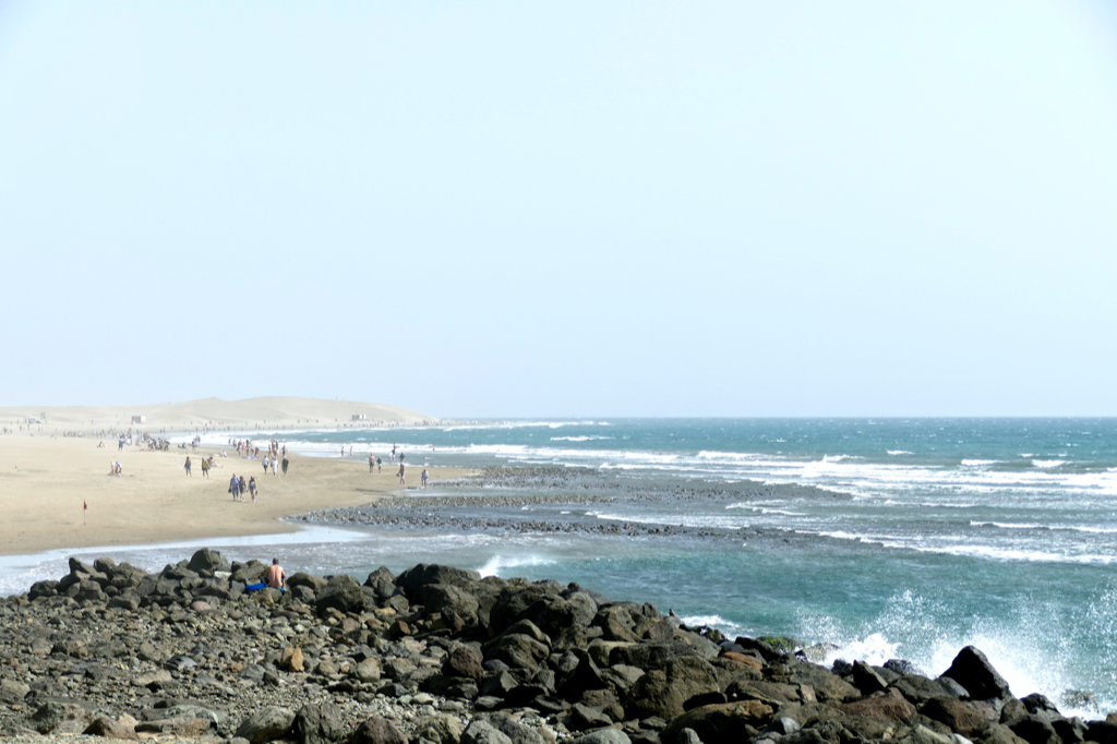 People walking on the beach of Maspalomas.