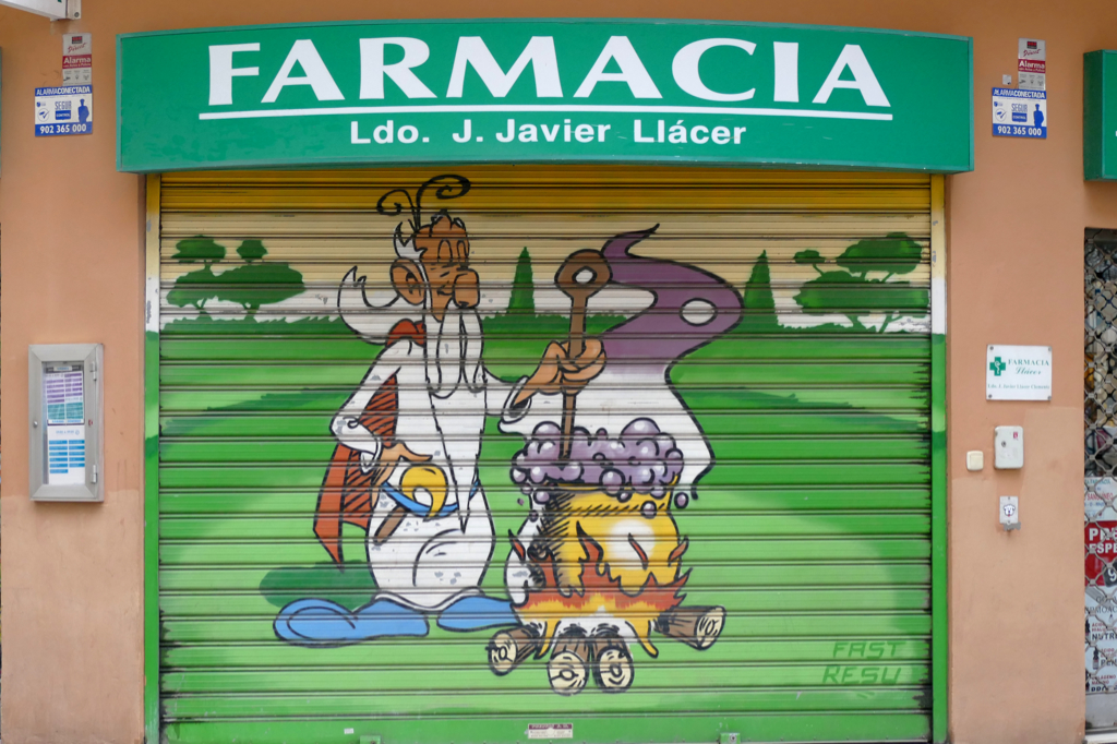 Painted shutter of a pharmacy in Valencia.