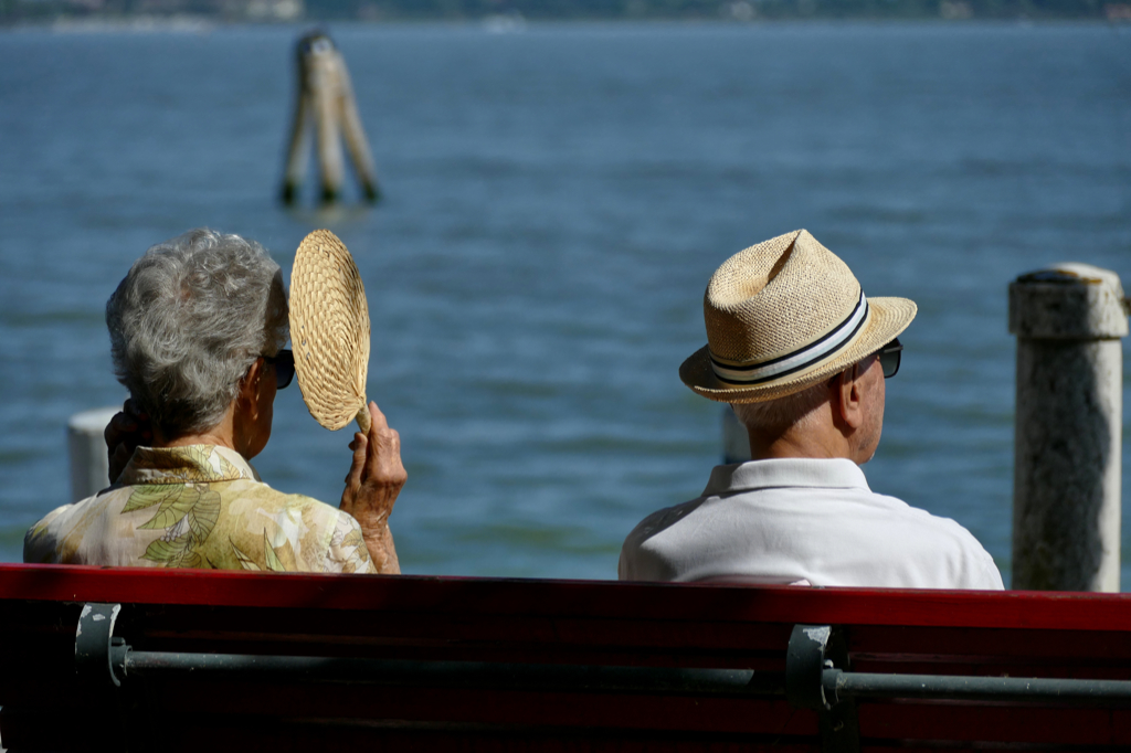 Old couple sitting on a bench in Venice
