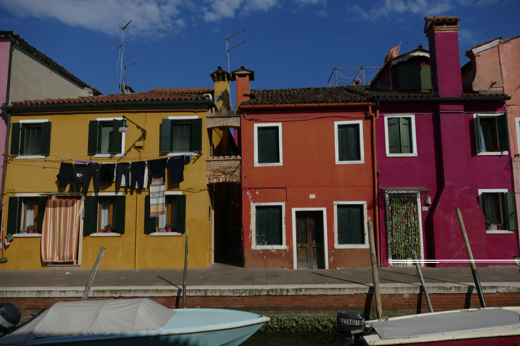 Colorful houses along a canal in Burano