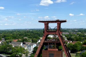 The iconic winding tower, the most important feature of the Unesco World Heritage Site Zeche Zollverein, with the city of Essen in the backdrop.
