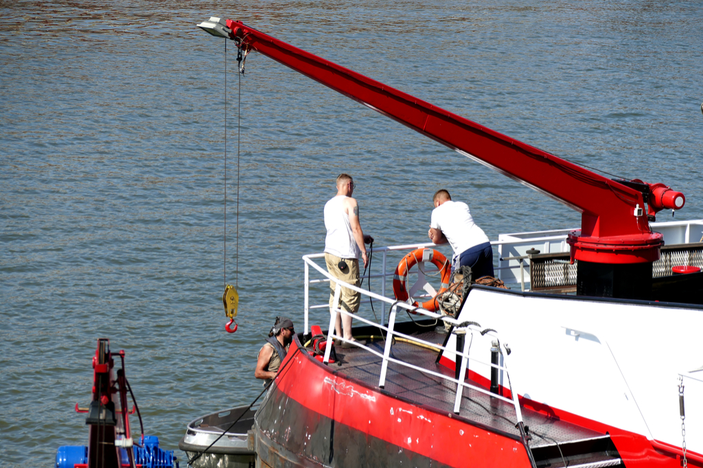 Man at work on a ship on the river Rhine