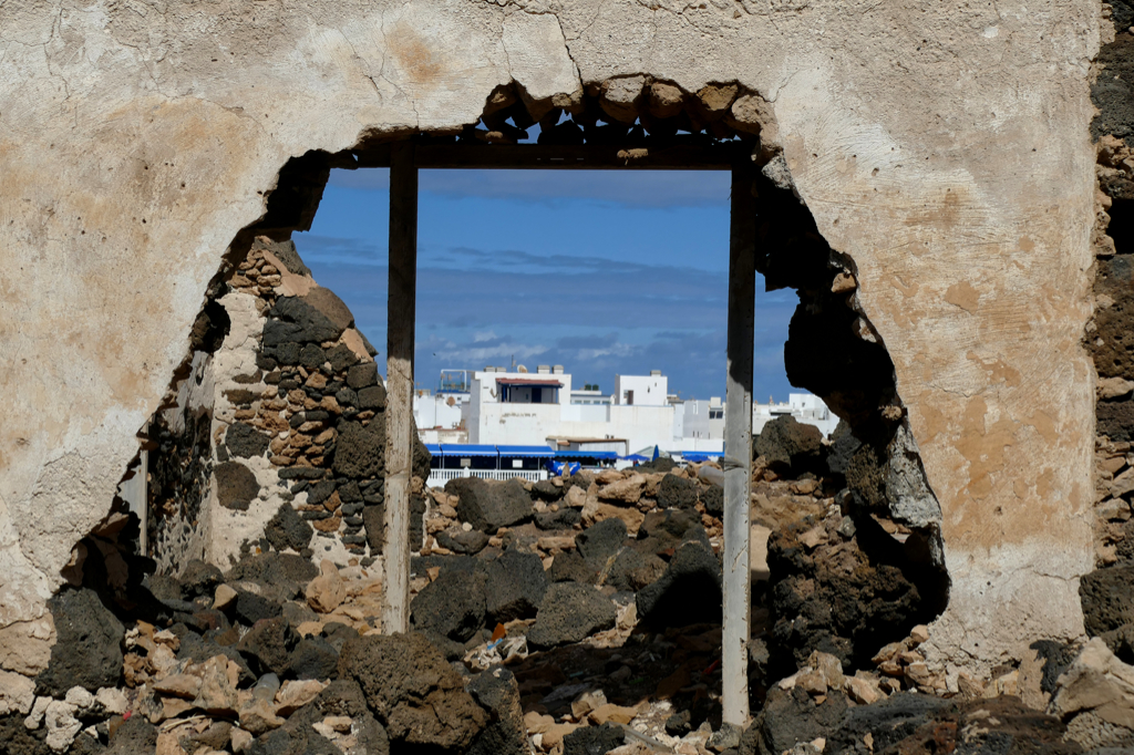 Demolished building and a view of El Cotillo