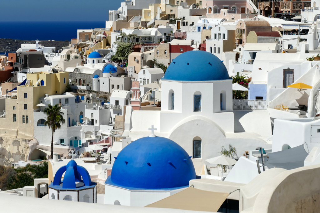 Santorini, Greece Cyclades architecture hotels houses over the caldera in  Oia santorini greek islands against mediterranean sea view with mountains  by