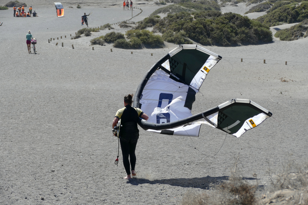 Woman carrying a kite in El Medano in Tenerife