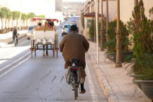Man on a bike in Meknes, the Versailles of Morocco