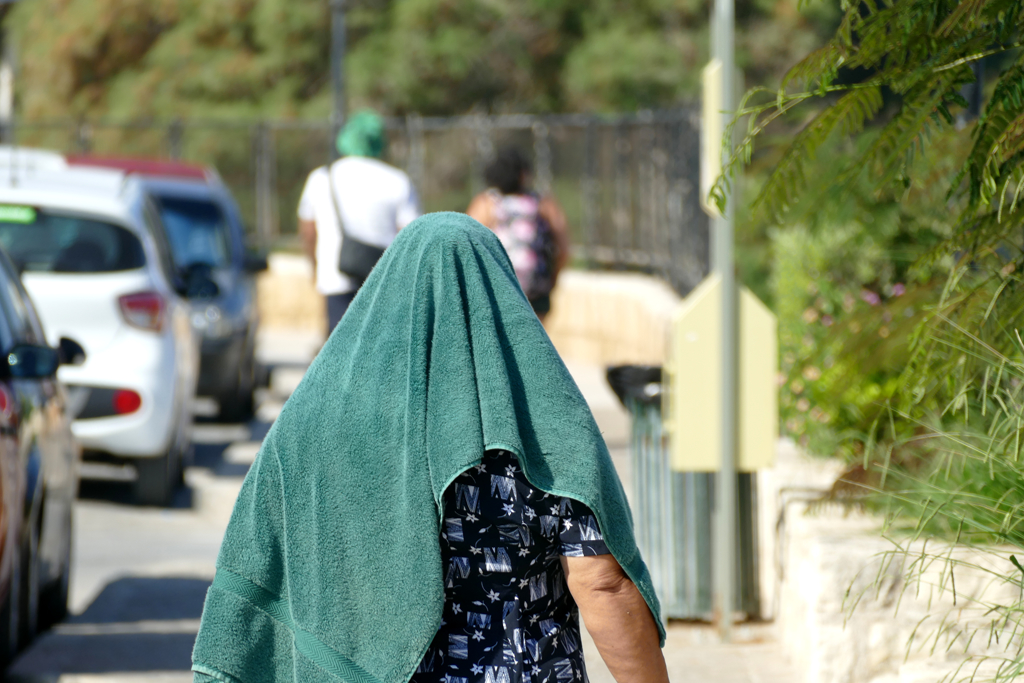 Woman with a towel on her head.