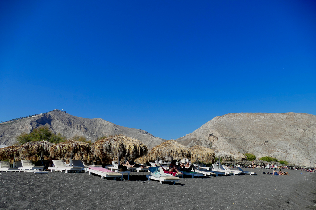 Black beach in Perissa, visited on a self-guided tour by public bus during three days on Santorini