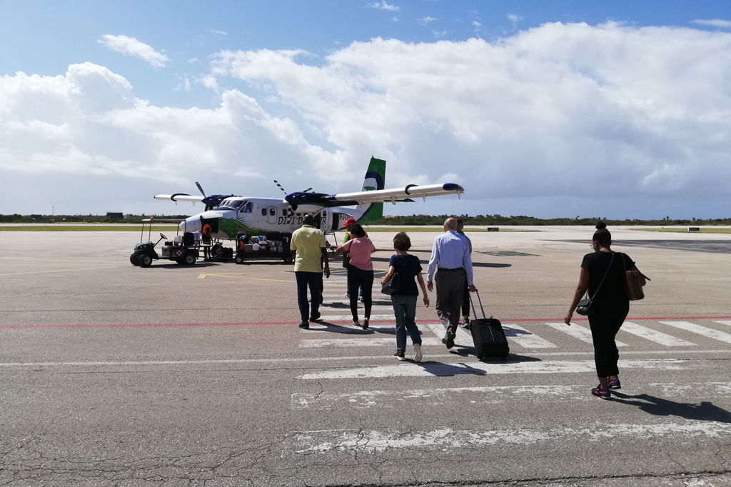 People boarding a plane in Bonaire.