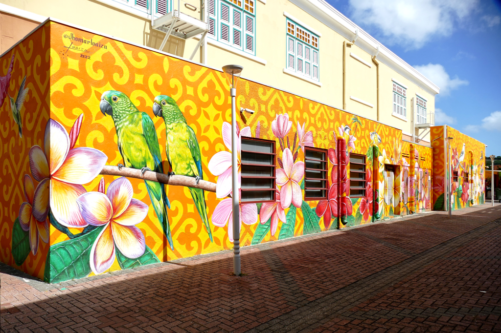 Mural of local flowers and birds by Jhomar Loaiza from Venezuela.