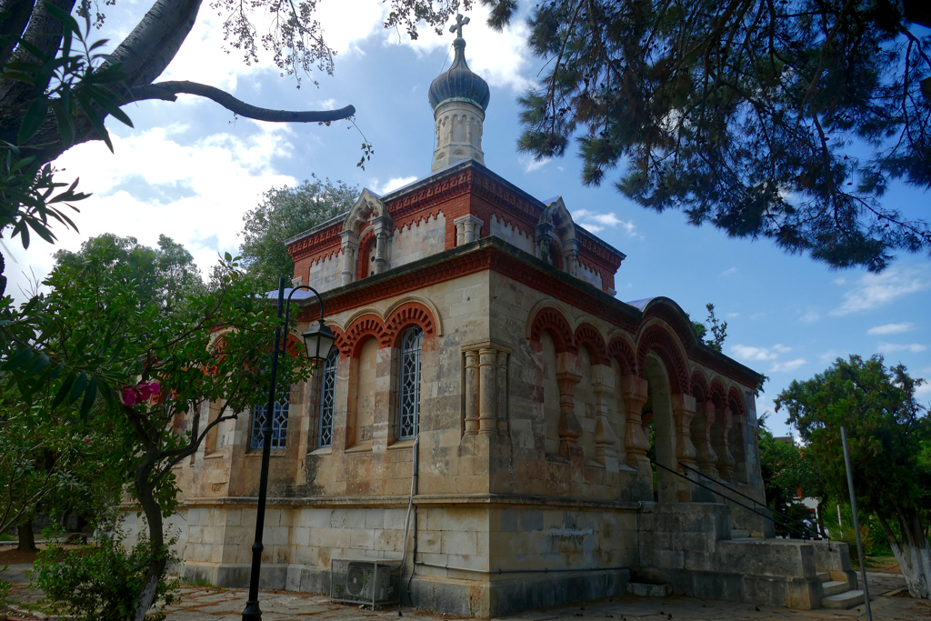 Orthodox Church of Saint Mary Magdalene in a serene park.