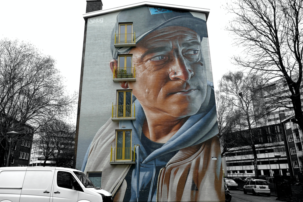 IF WALLS COULD SPEAK: The Best Street Art Project in Amsterdam: Better a Good Neighbor Than a Distant Friend by Smug One, an Australian-born artist now based in Glasgow.