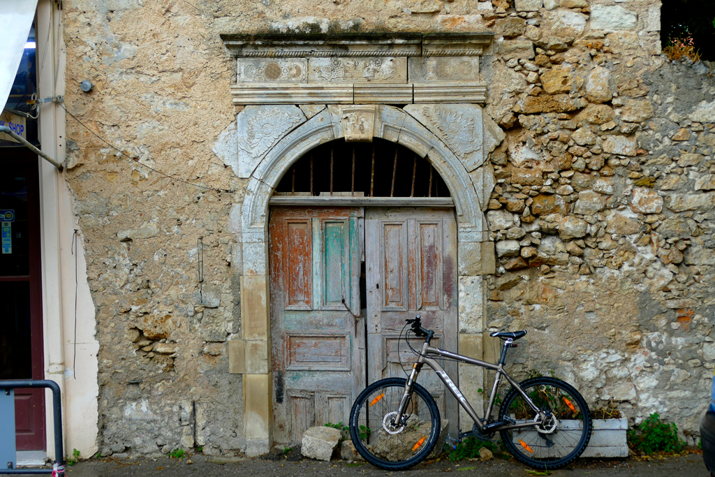 Bicycle in front of an old wall in Rethymno.