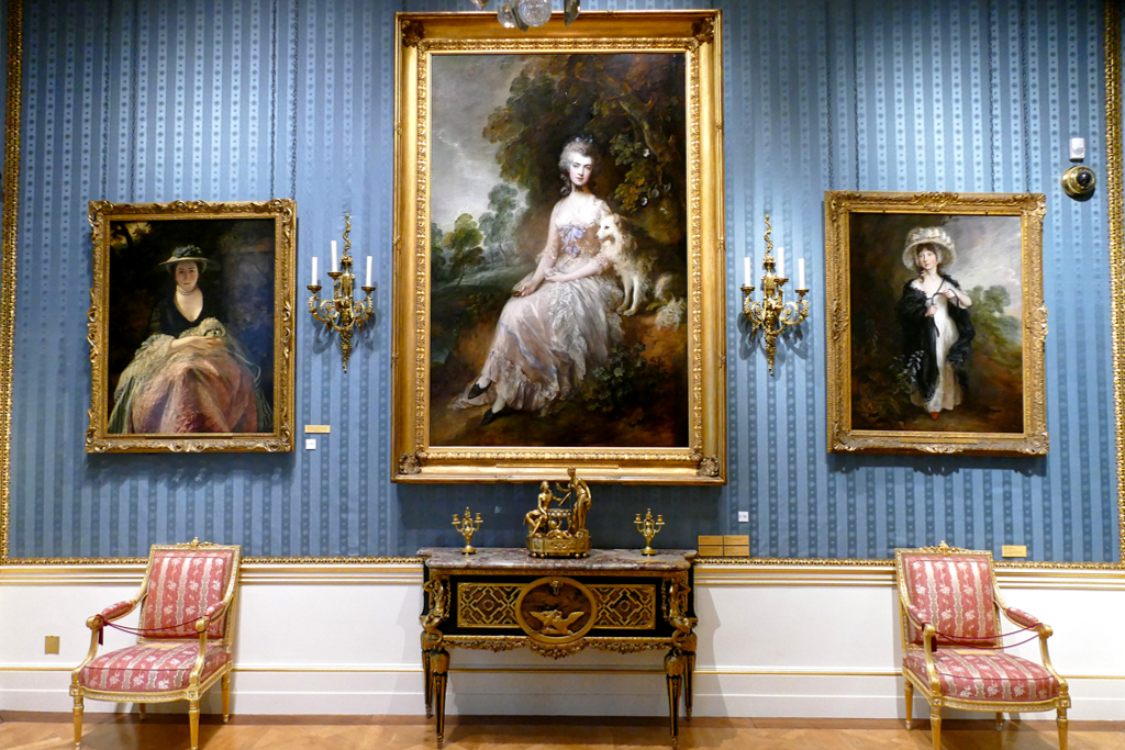 Portraits from left to right: Nelly O'Brian by Sir Joshua Reynolds, Mrs. Roberts and Miss Haverfield by Thomas Gainsborough above some charming furniture.