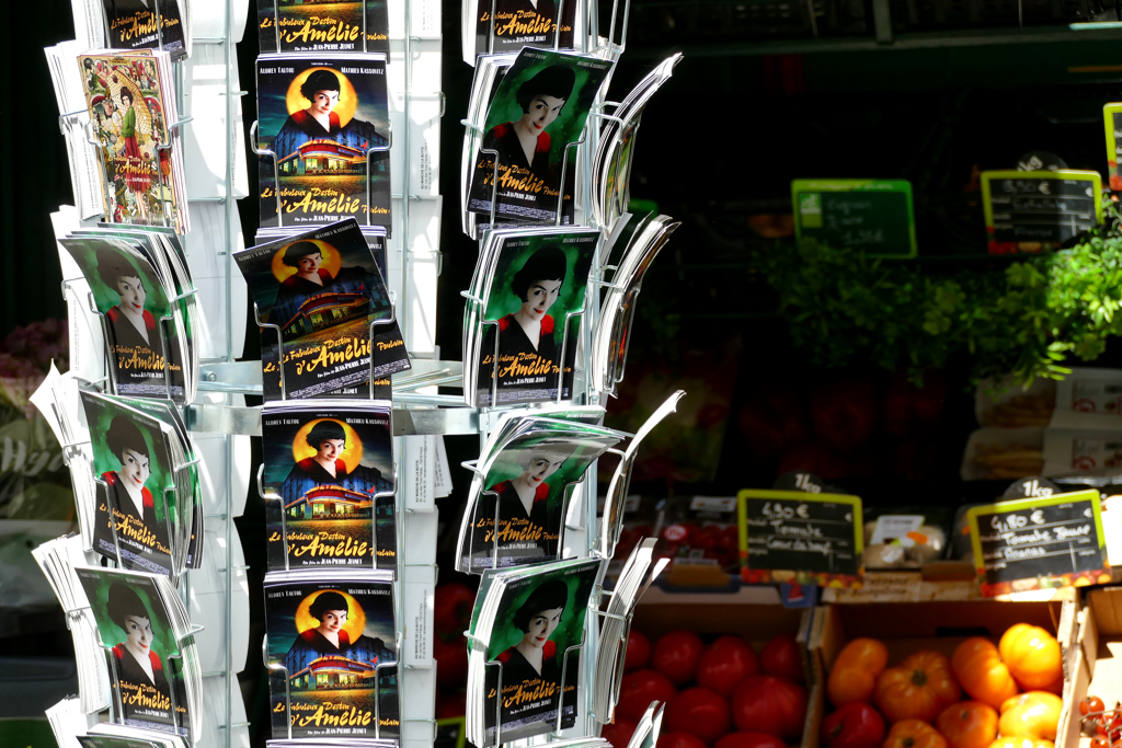 Amélie postcards in front of a greengrocer in Montmarte in Paris. 24 hours in Paris
