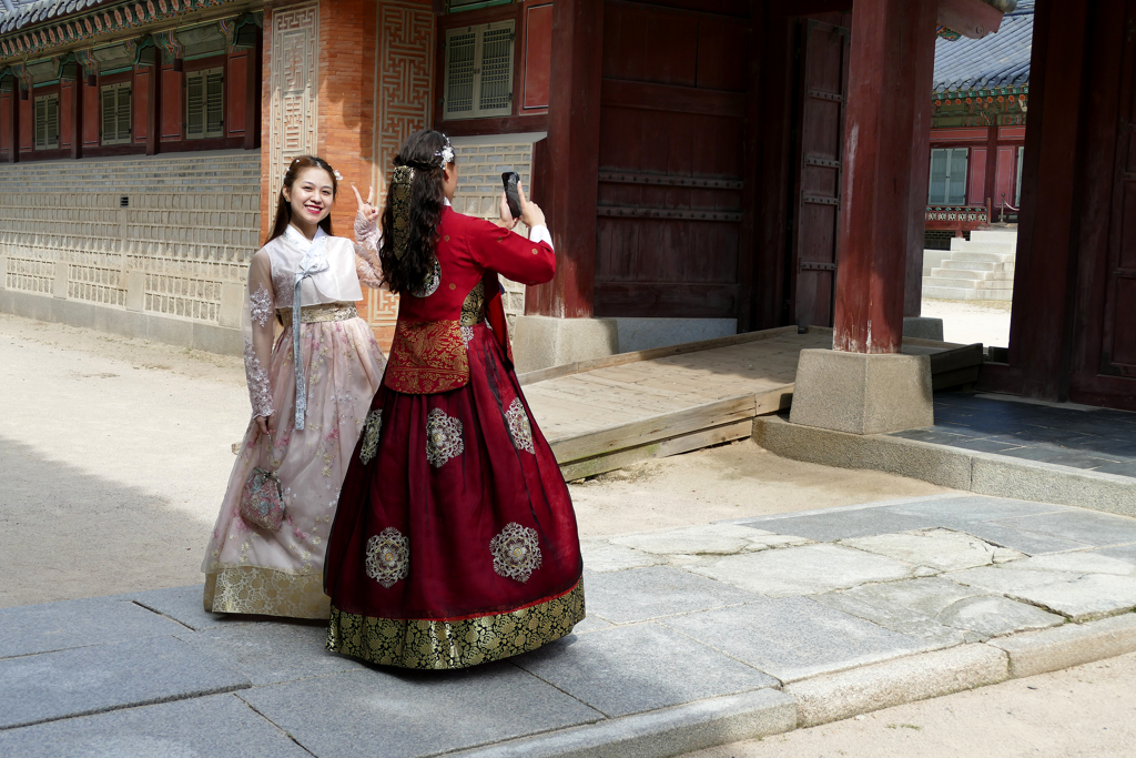 Tourists in Hanboks at the Gyeongbokgung Palace in Seoul.
