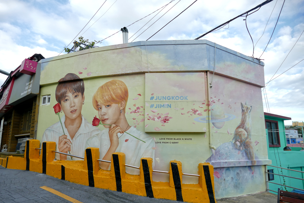 Portraits of Jungkook and Jimin at the Gamcheon Culture Village in Busan.