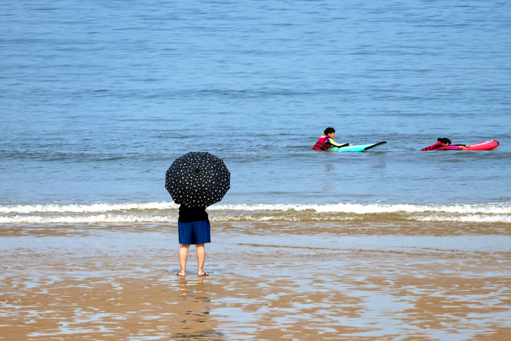 Surfing children on Mallipo Beach