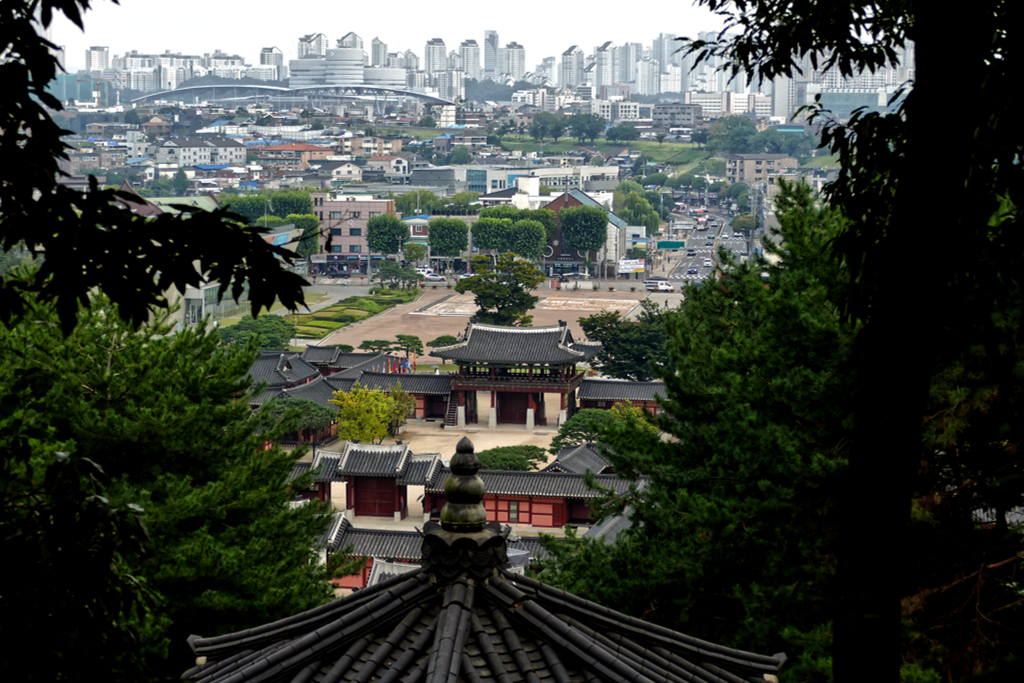 View of the Hwaseong Haenggung with Suwon's impressive skyscape in the backdrop.