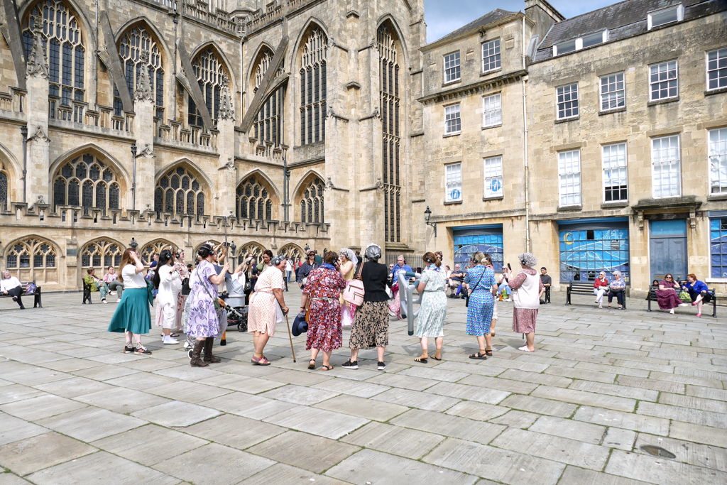 An outdoor hen party in front of the venerable Bath Abbey.