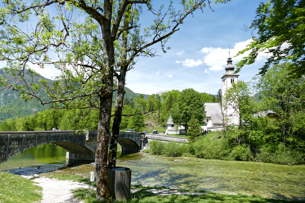 Bohinj's stone bridge and the 700 year old Cerkev Svetega Janeza Krstnika, hence, Church of Saint John the Baptist.