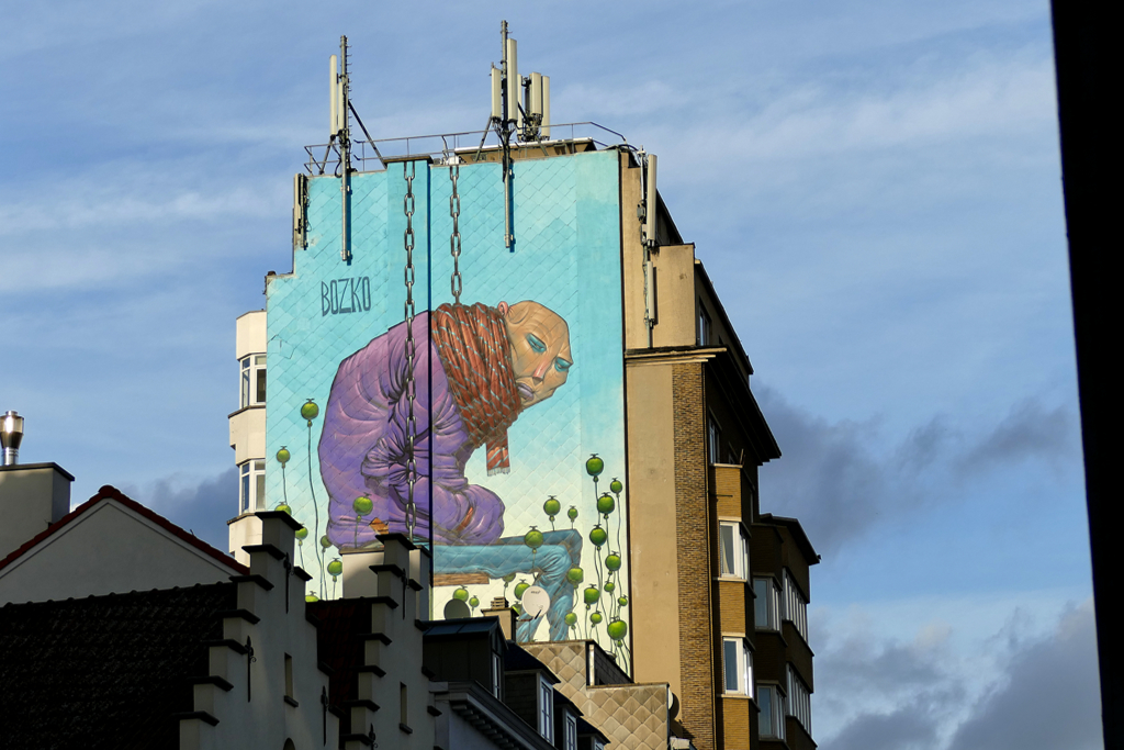 Mural by Bozka, one of the best pieces of street art in Brussels.