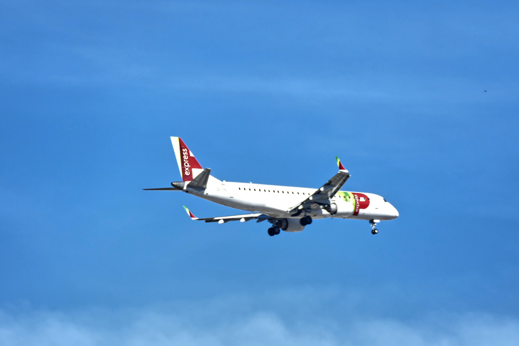 TAP plane in the sky above Lisbon.