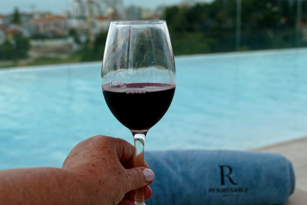 Glass of Port next to the pool of the Renaissance Porto Lapa Hotel