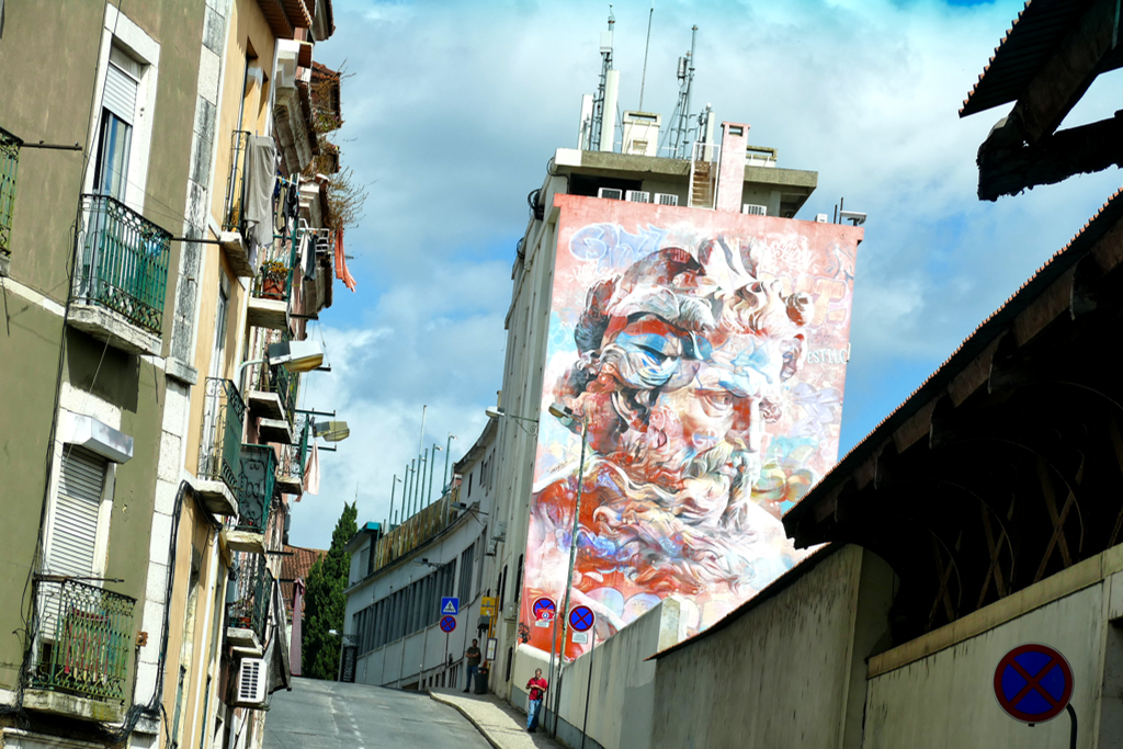 Mural by PichiAvo, one of the best pieces of street art in Lisbon outside the Graca district.