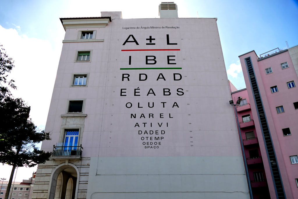 Mural by MasMenos on the occasion of the 50th anniversay of Portugal's Carnation Revolution.