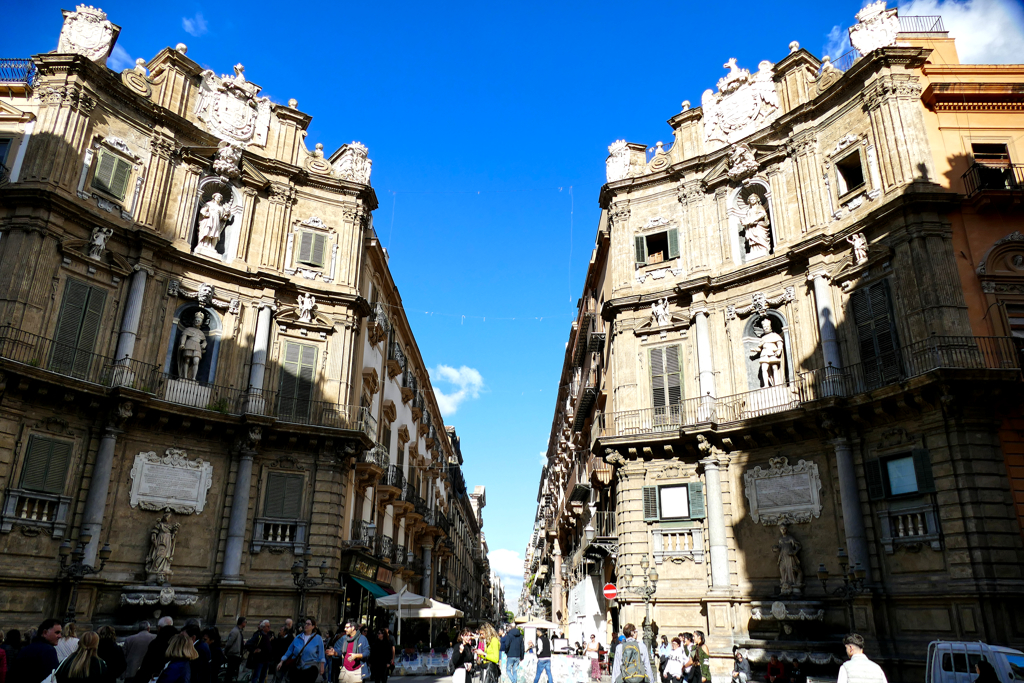 Two of the four facades that form the Quattro Canti. The fountains and sculptures are framed by columns that follow the Doric, Ionic, and Corinthian order from bottom to top.