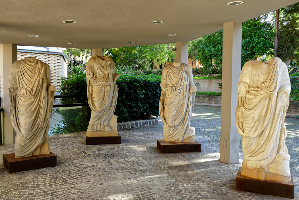 A collection of chic Roman togas at the Museo Archeologico Regionale Paolo Orsi.