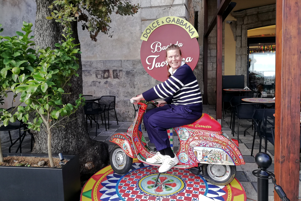 Renata Green on a Vespa by Dolce & Gabbana.