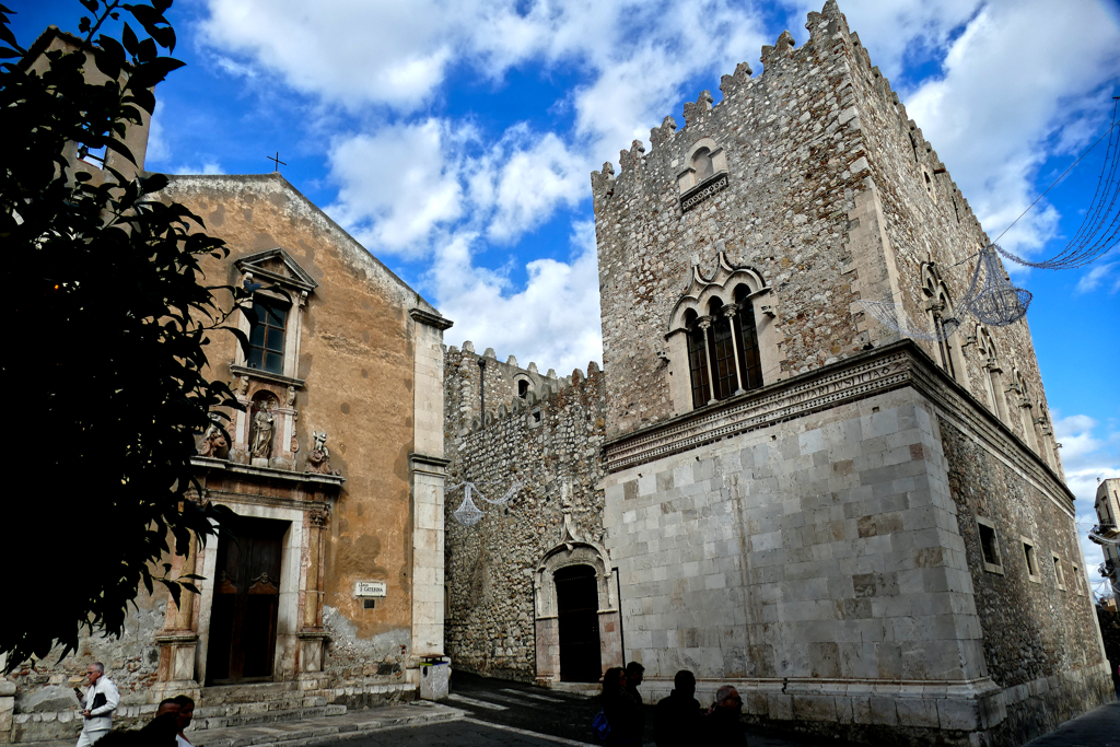 Piazza Santa Caterina with the Chiesa di Santa Caterina to the left and the stately Palazzo Corvaja to the right.