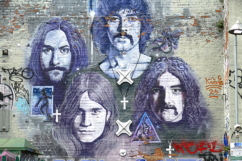 Mural depicting Black Sabbath, one of the best pieces of street art in Birmingham.
